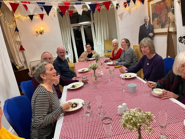 The group enjoying pudding on Sunday night at Copper Beech house.
